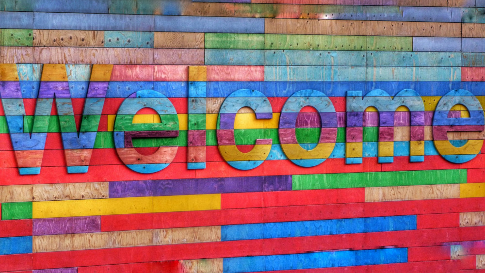 Colorful Welcome Sign on a Colorful Wall